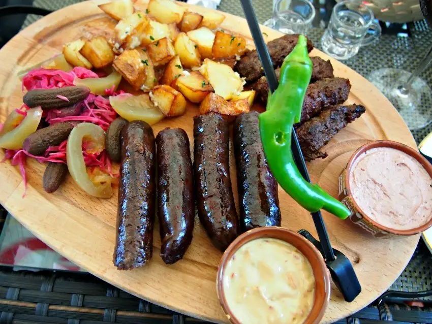 Romanian restaurant meal, venison sausages, mici, pate, potatoes