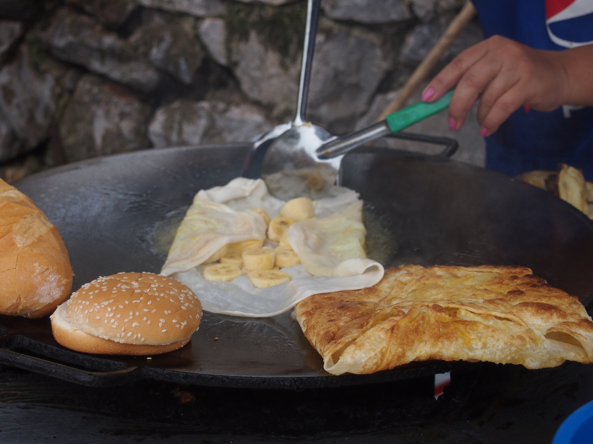 Laos street food Roti or pancakes street food vendor cooking roto